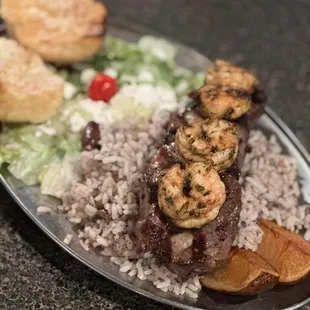 a plate of food with meat and rice