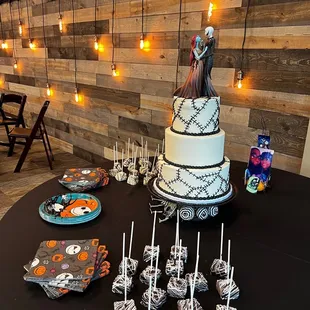 a wedding cake with a skeleton topper