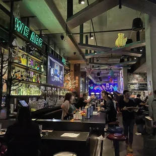 people sitting at tables in a restaurant