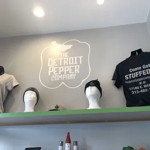 Inside waiting area... with t-shirts.