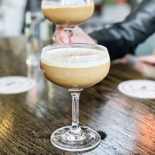 two cocktails on a table