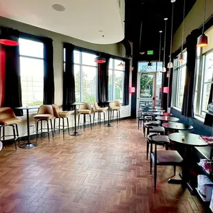 a view of a large room with tables and chairs