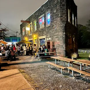 people sitting at tables outside