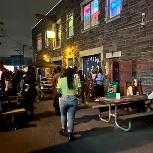 a woman walking past a group of people