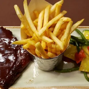 Half rack with French fries and chef vegetable of the day.