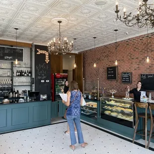 a woman standing in front of a counter