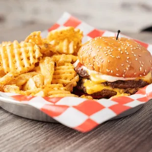 a hamburger and fries in a basket