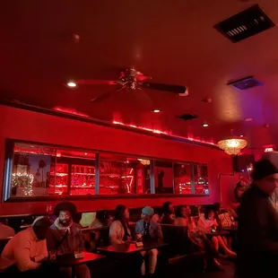 a group of people sitting in a restaurant