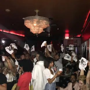 a group of people holding up signs