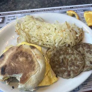 Breakfast sandwich, hash browns and sausage patties