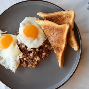 a plate of food with toast and eggs