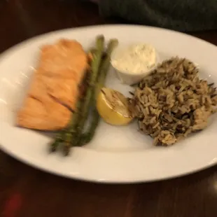 a plate of fish, rice and asparagus