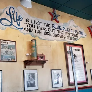 a wall with a sign that says life is like the place where you would eat, drink, and the rest