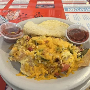 Migas with Corn tortillas and home made spicy tasty salsa!