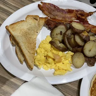 Eggs, bacon, potatoes and toast