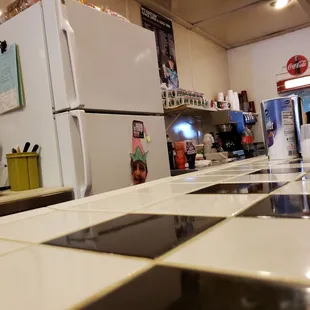 a kitchen with a stove and refrigerator