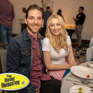a man and a woman sitting at a table