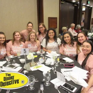 a group of women sitting around a table