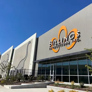 Outside. It's listed as Billings but also the Dinosaur Company so look up both before googling in Maps