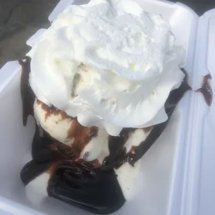 an ice cream sundae in a styrofoam container