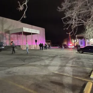 people walking in the parking lot