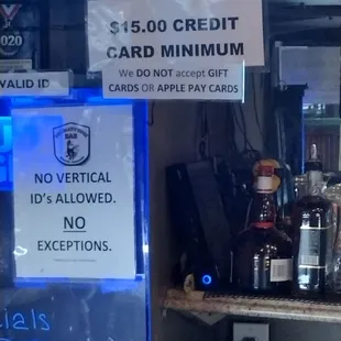 a sign that reads $ 5 00 credit card minimum