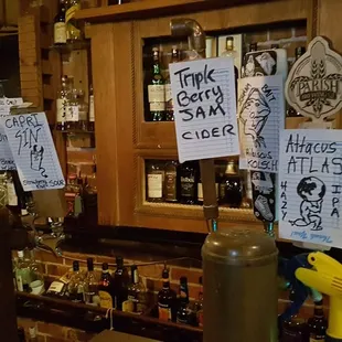 a bar with a bunch of signs on it
