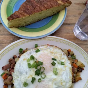 Corned beef hash with 2 eggs and a side of scone