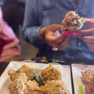 a plate of fried chicken with a side of celery