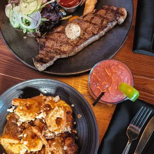 Steak Frites and Shrimp, chorizo, and grit cakes
