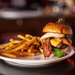 a burger and fries on a plate