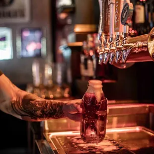 a bartender pouring a drink