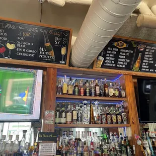 Wine &amp; beer menu up on the wall.