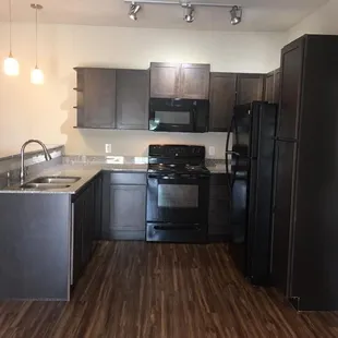 The kitchen is well laid out.  So much storage and opens into living area.