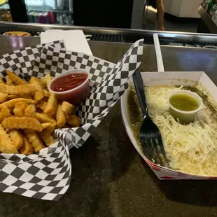 Green rolled tacos and fries