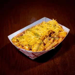 a hot dog covered in cheese