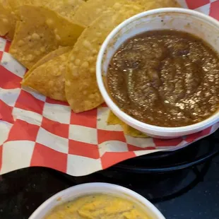Chips with salsa and queso (what's left of the chips)