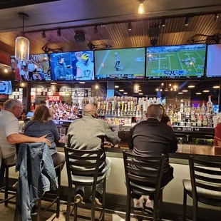 people sitting at the bar