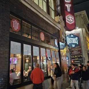 people walking on the sidewalk