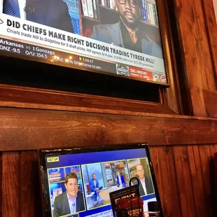 There are TVs in the booths
