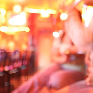 a woman sitting at a bar