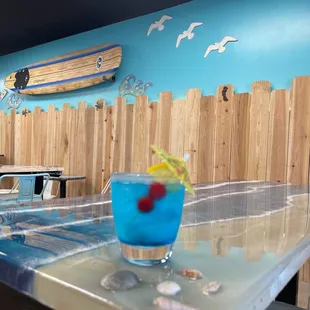 a blue drink with a garnish garnish garnish garnish garnish garnish ga