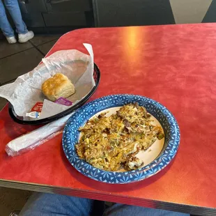 The junkyard plate special! Eggs, sausage, peppers, onions and cheese with a biscuit and gravy.