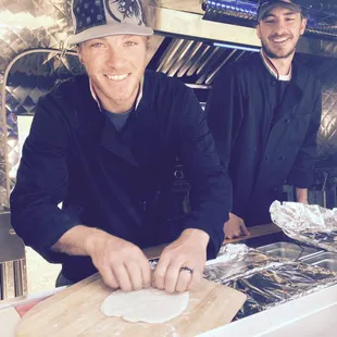 The Helmer brothers rolling out some house-made pizza dough.