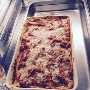 Lasagna with house-made truffle pasta, Italian Sausage, peppers and onions.