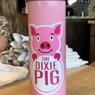 a pink cup with a straw