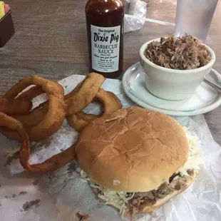 Jumbo Pig Sandwich, Housemade Onion Rings, and our world famous Dixie Pig Sauce.