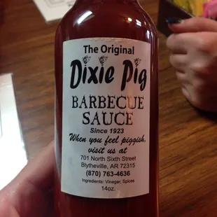 Pick up one of the bottles of sauce for yourself