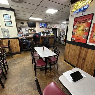 a restaurant with tables and chairs