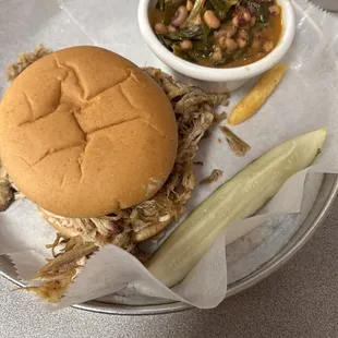 Pulled pork Pulled Pork BBQ Sandwich with Red Slaw Black eyed peas with collards